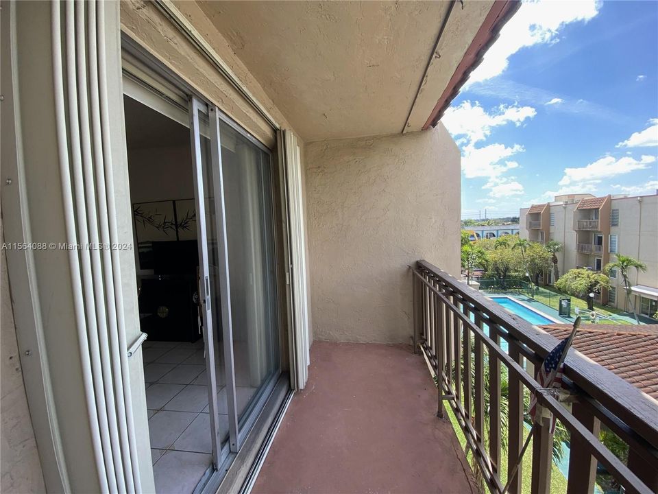 View of balcony and hurricane shutters.