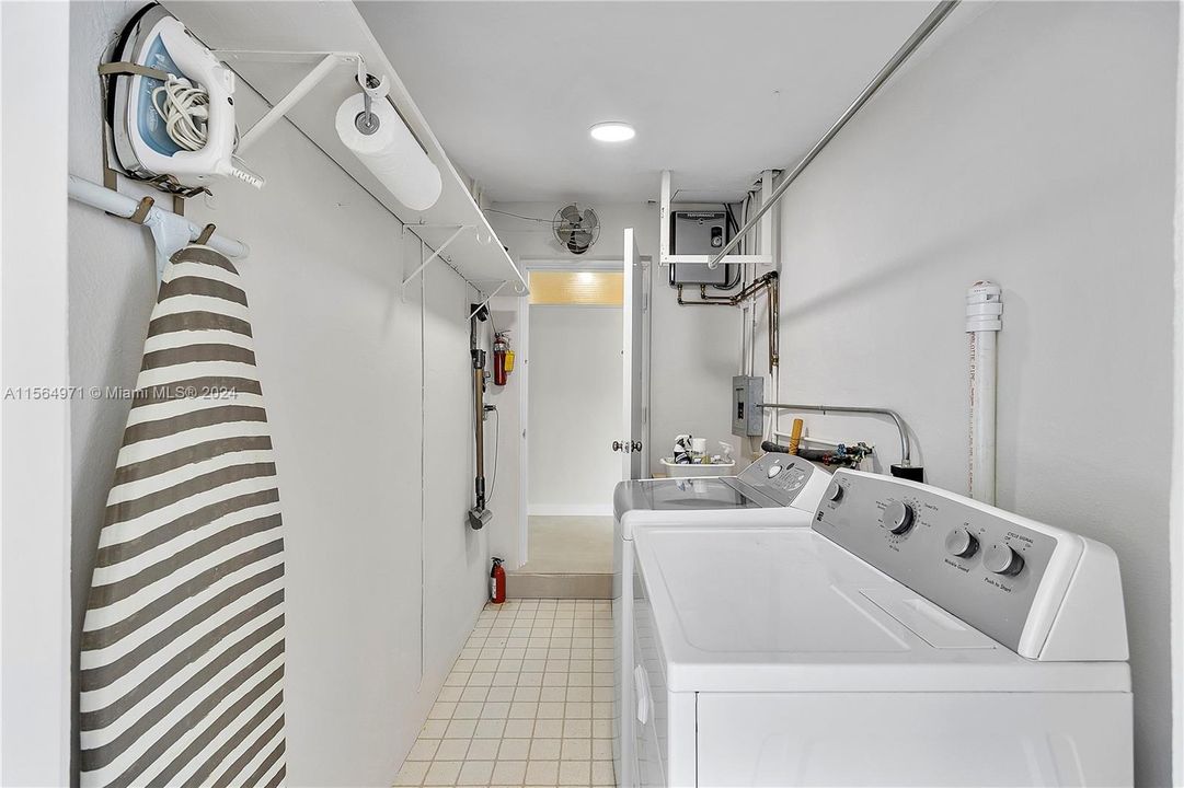 Ideal for practicality, this laundry room offers dual access with doors to both the interior and exterior of the home.