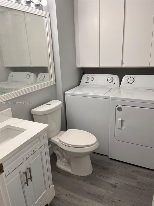 half bath and laundry with new washer and dryer