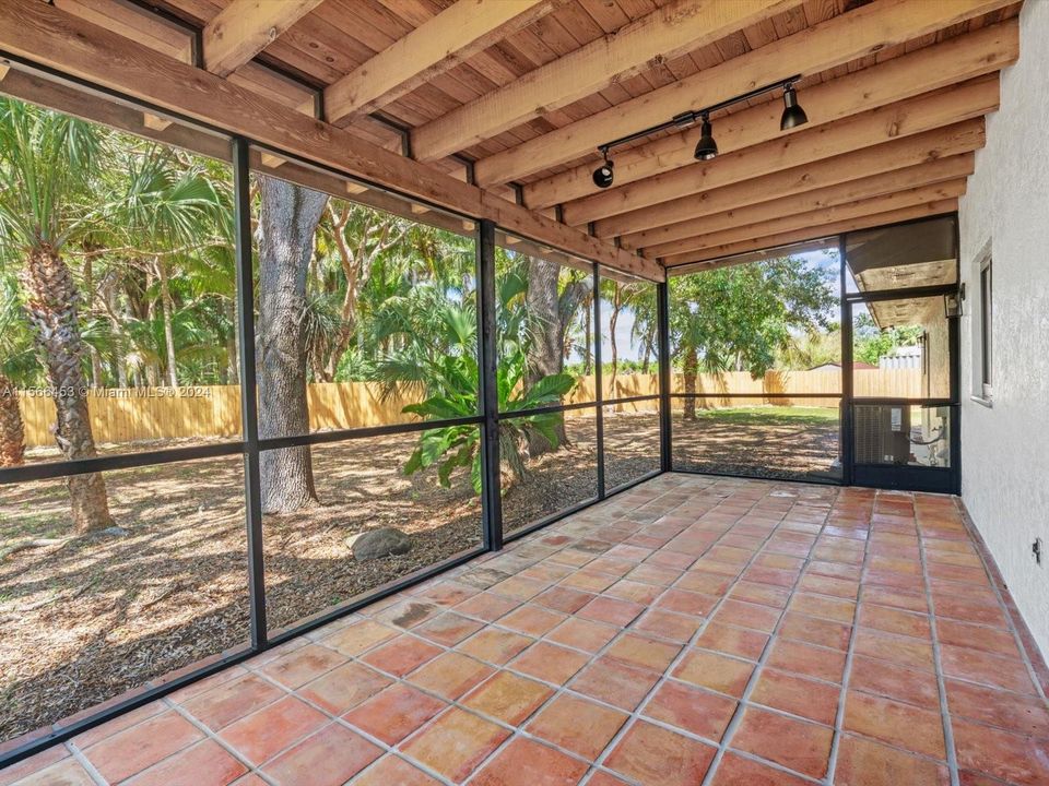 Beautiful, airy screened patio for enjoying the outdoors and watching nature.