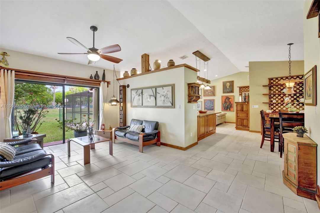 Bright welcoming Living Room w/ Gorgeous Handmade Tile in all living areas & main bedrooms; Volume Ceilings