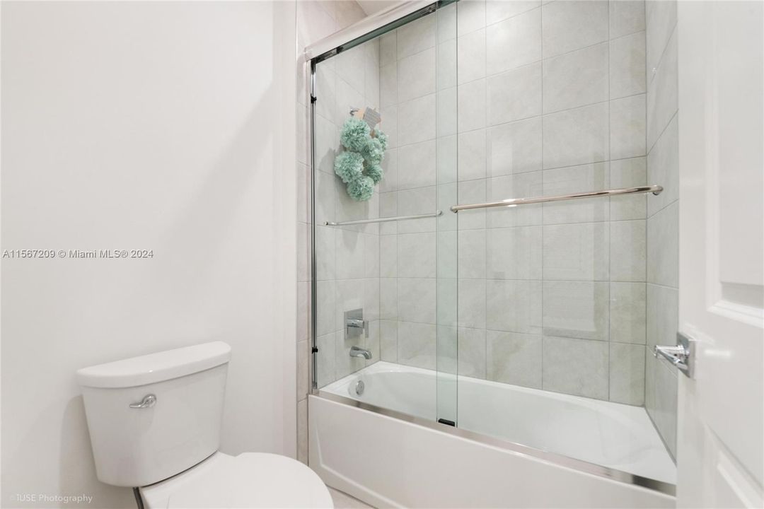 Third bathroom's convenient separate area for toilet and shower