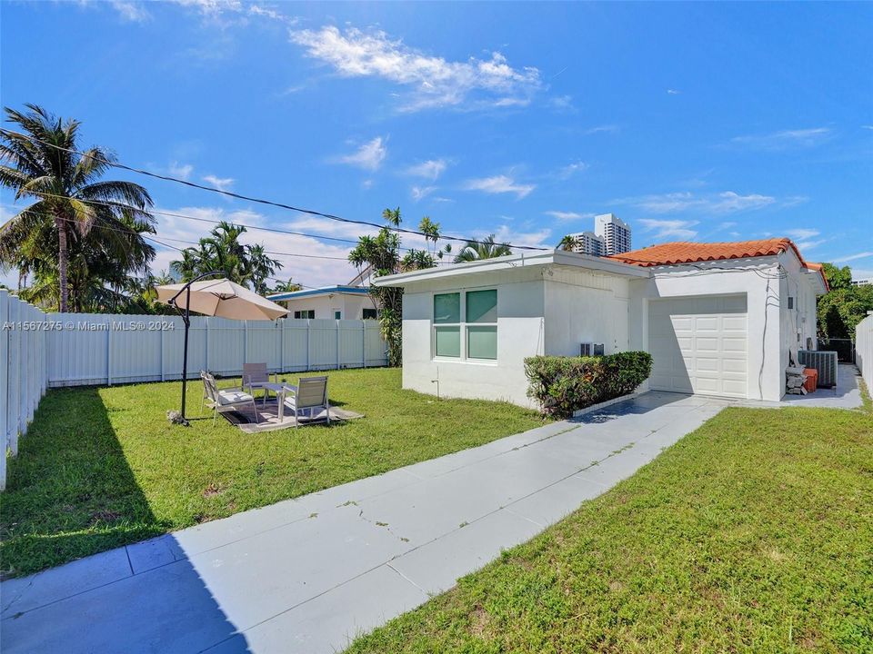 A driveway from the back street leads to the garage, providing additional parking options for you and your guests.