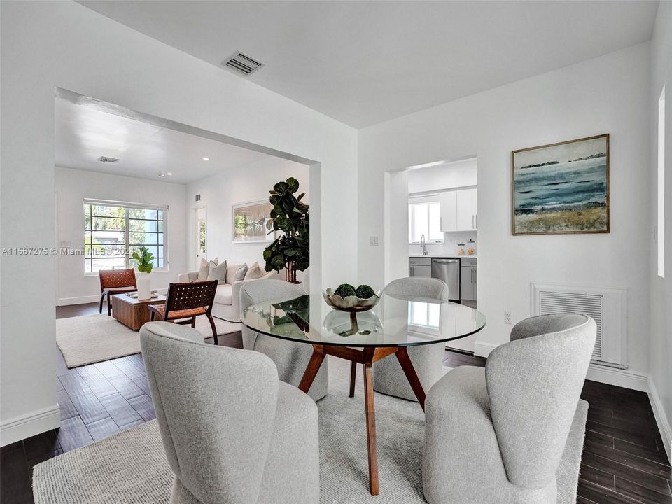 The dining area opens into the kitchen, living room, and den areas making this one of the focal points of the property.