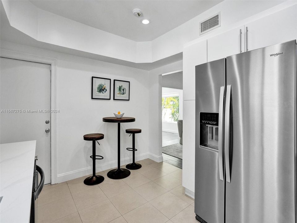 Stainless steel appliances adorn the kitchen.