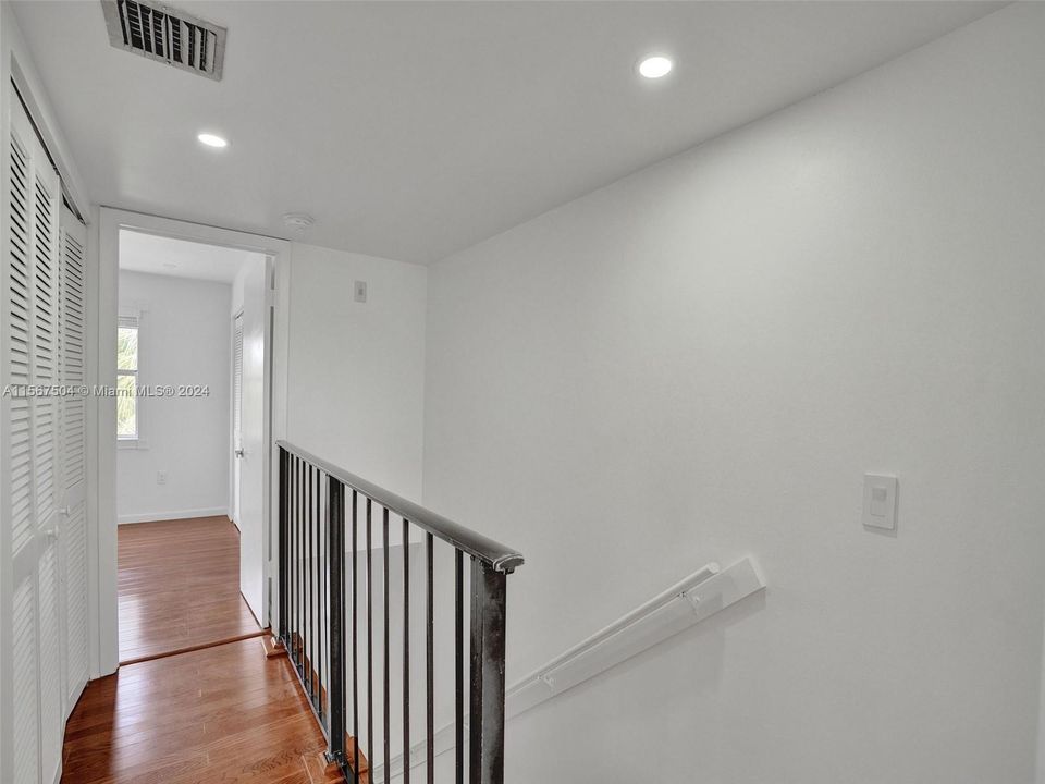 Hallway leads to hallway leads tobedroom #2 (above) and also to bdrm #1.