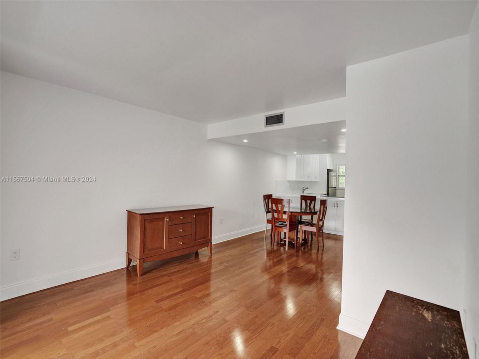 Open Floor Plan:  Living room opens to balcony and adjoins dining room, kitchen & half bath