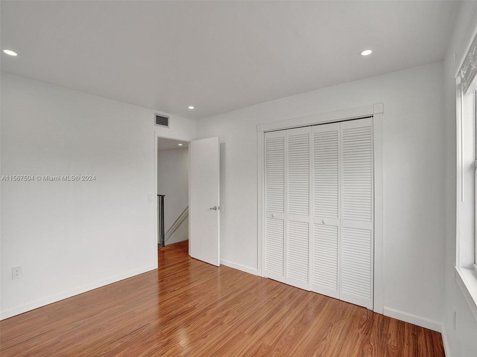 Bdrm #1 - large wall to wall close gleaming natural wood floors throughout 2nd floor