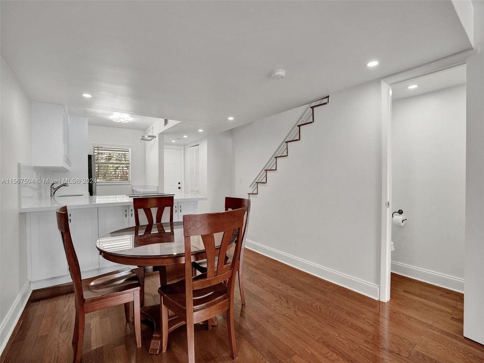 Dining room opens to new kitchen and large living room and 1/2 bath