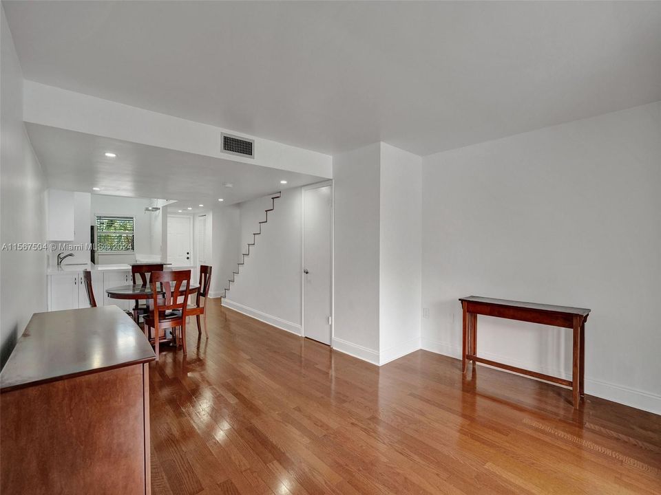 Gleaming laminate wood floors downstairs, (natural wood floors upstairs)