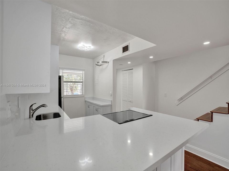 Open floor plan. New kitchen with pass-through to living room/dining room