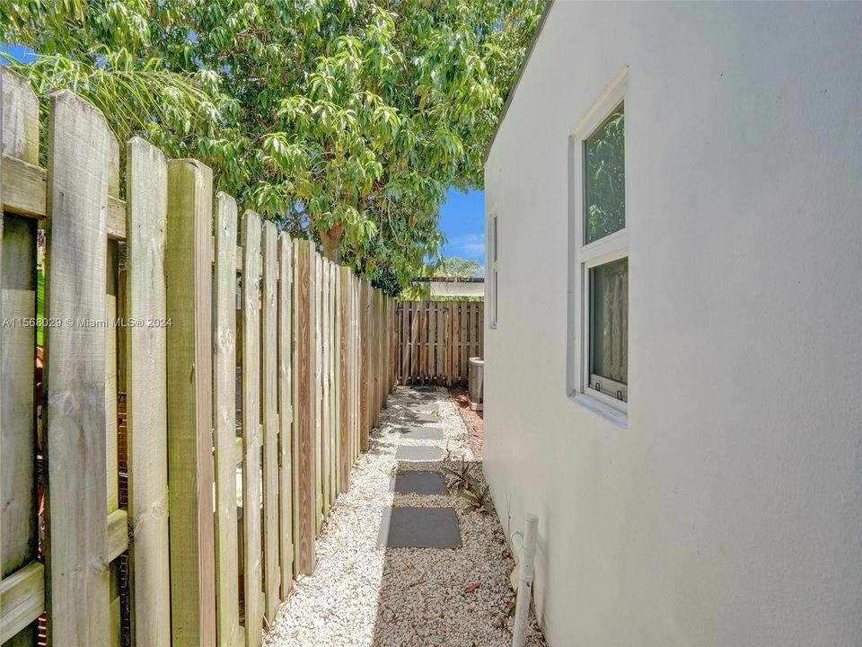 Side walk from back yard to front of the house