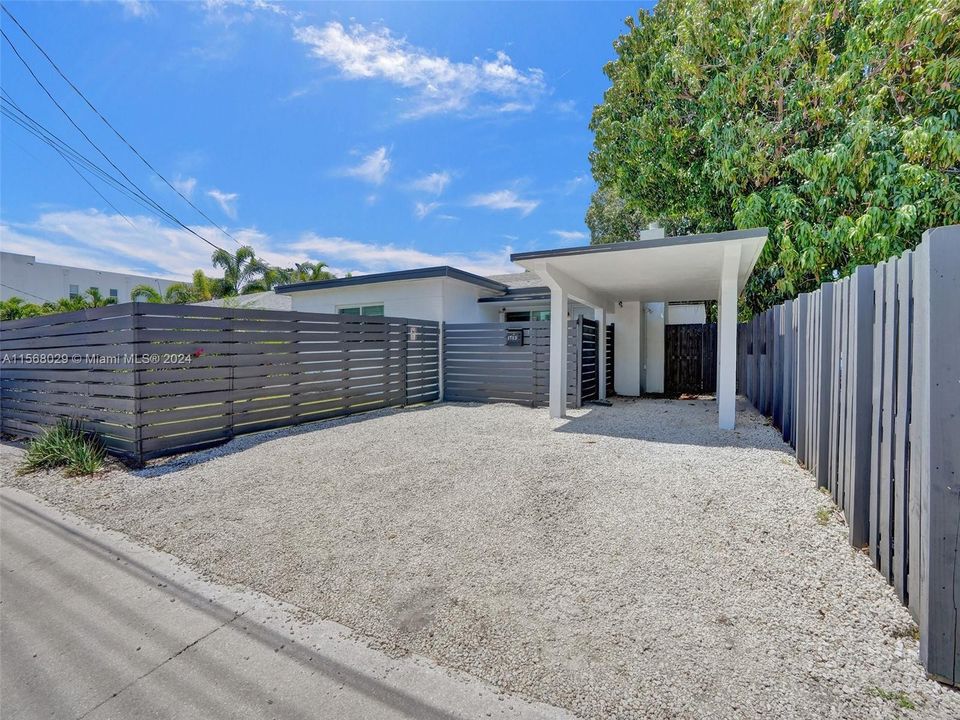 Driveway with carport, parking for 3 cars