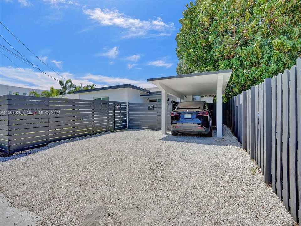Driveway with carport, parking for 3 cars