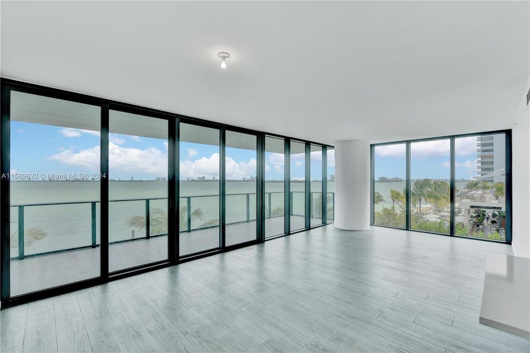 This is a corner unit with floor to ceiling windows.