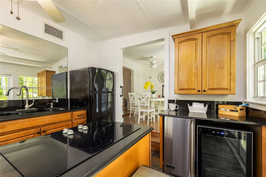 Unleash your culinary prowess in this large chef's Kitchen with French Doors out to the Deck.