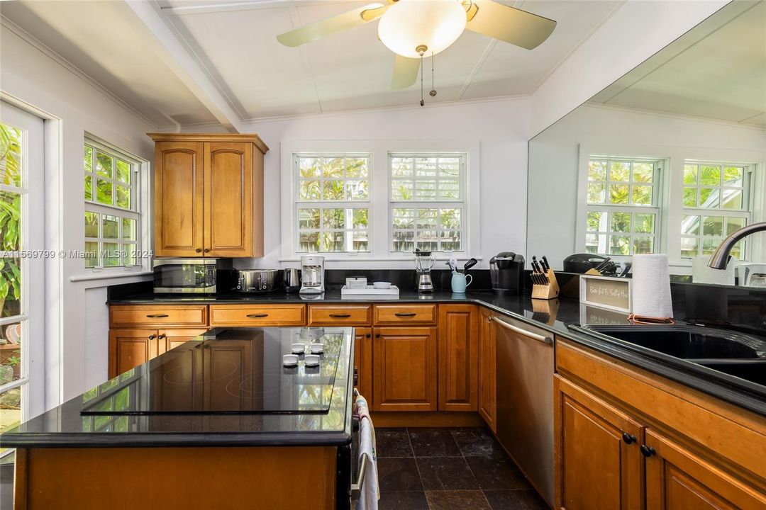Unleash your culinary prowess in this large chef's Kitchen with French Doors out to the Deck.