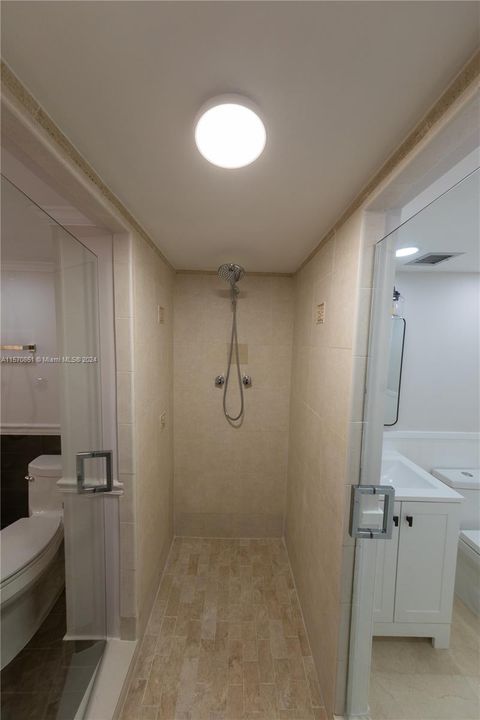 shower adjoins guest and primary bathrooms