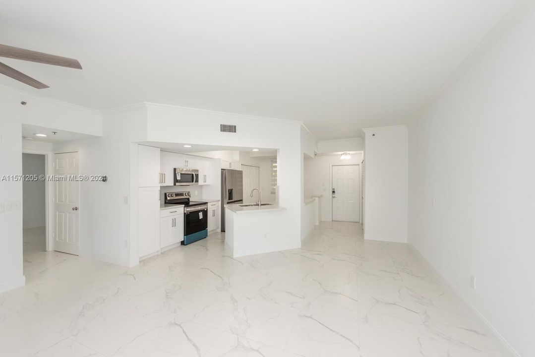 Living/dining looking at kitchen.