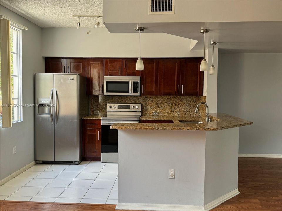 kitchen - Stainless Steel Appliances, Solid Countertops & Redwood Cabinets