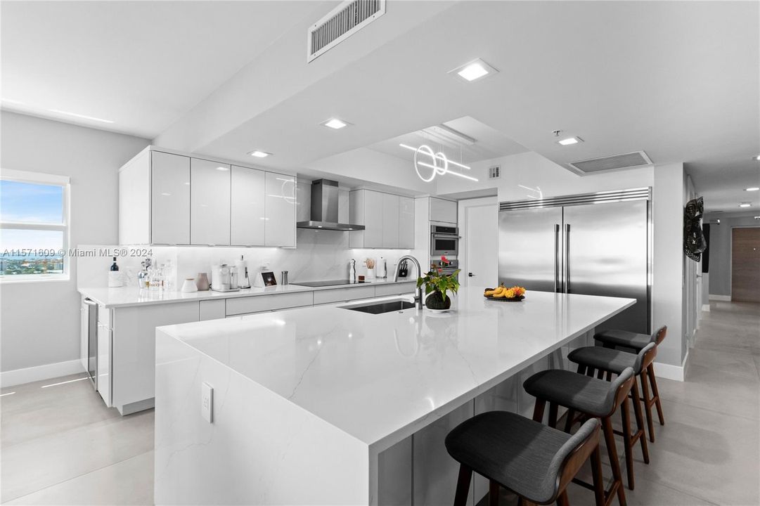 Custom Chef's Kitchen planned with sharp attention given to detail and function. Note that the Island measures 5.5' x 11' & has additional storage in front of the barstools and at the opposite end.