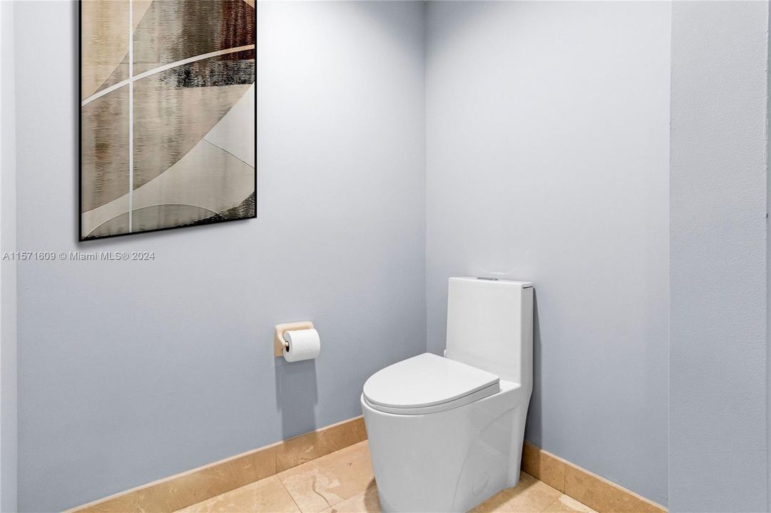 Primary Bathroom with New One-Piece Dual Flush Water-Saver Toilet.