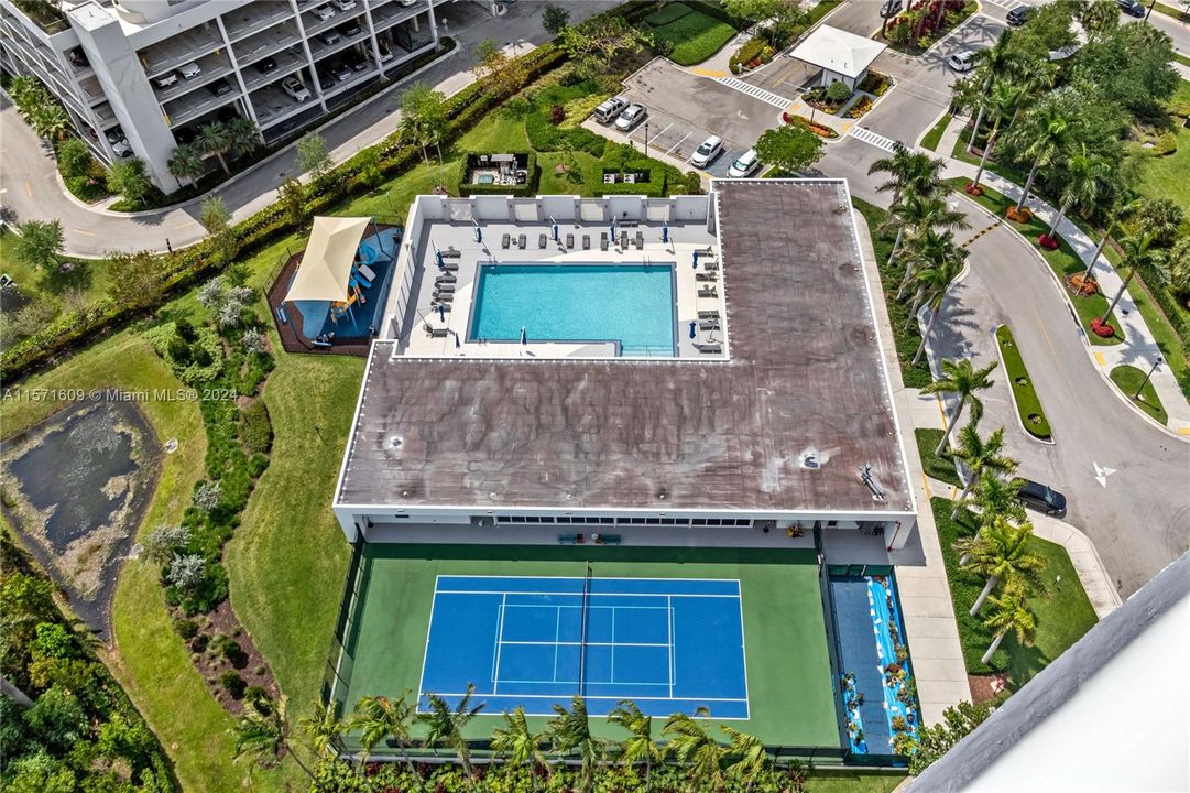 Amenities Complex featuring Tennis/Pickleball Court, Gym, Pool, Clubroom w/Kitchen, Children's Playground, Restrooms.