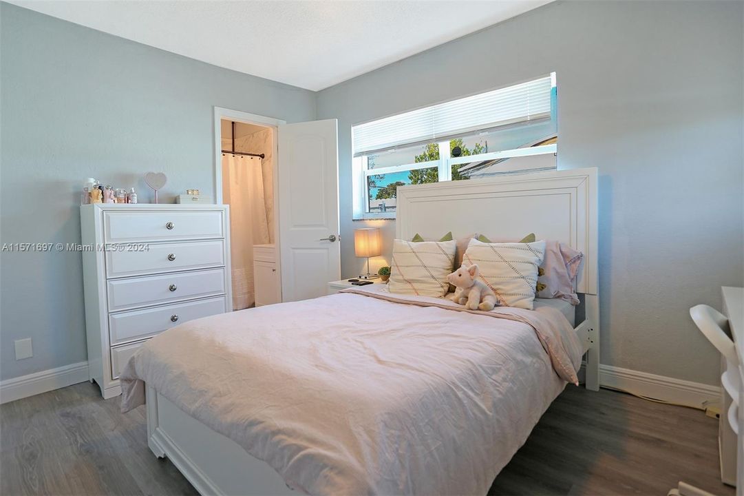 Master Bedroom with Large Impact Window