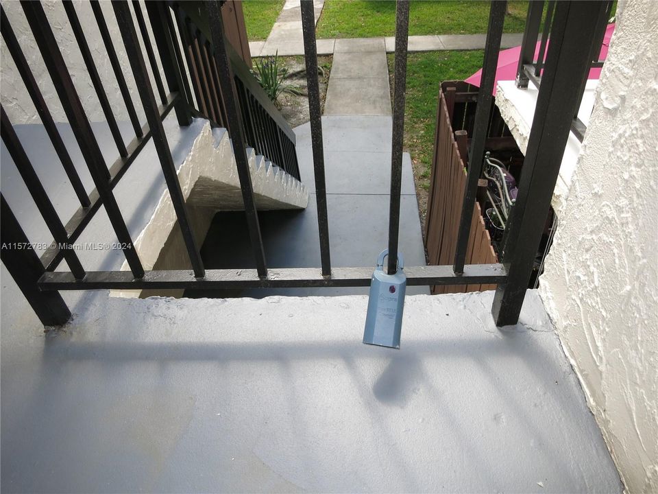 Supra is located to the left side of the stair rail.