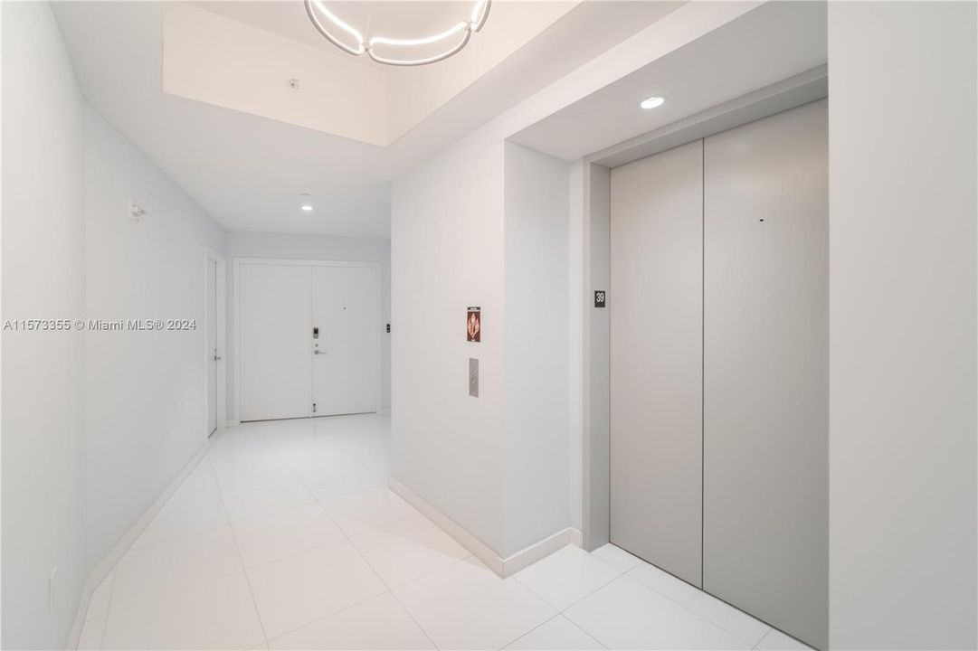 Foyer with Private Elevator and Double Door Entrance