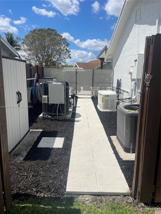 Side yard with pool equipment, generator and A/C