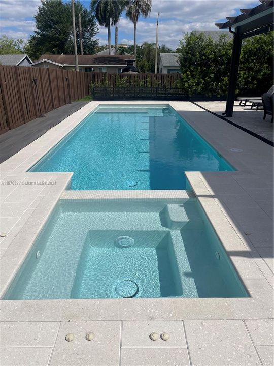 Luxury heated smart pool and spa with sun shelf