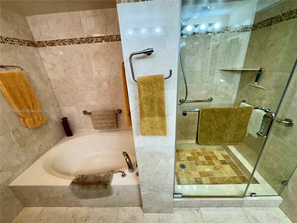 All Hand Built Custom Cherry and Quartz Granite Master BathGold in-lay Vessel Sinks W/ Europian HansGrohe fixtires throughoutW/ Seamless Glass Shower Stall and Large Roman Jacuzzi Spa18" Marble with Custom tumbled pepple stone in-lay