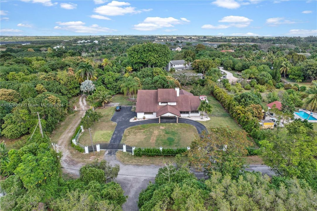 AERIAL VIEW .88 ACR PROPERTY UPDATED 4/3 HOME W/ ASST. FRUIT TREES