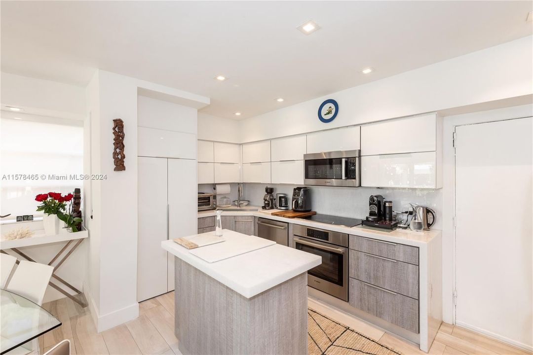 Remodeled Kitchen - Recessed Lighting - Marble Counter Tops - Stainless Steel Appliances