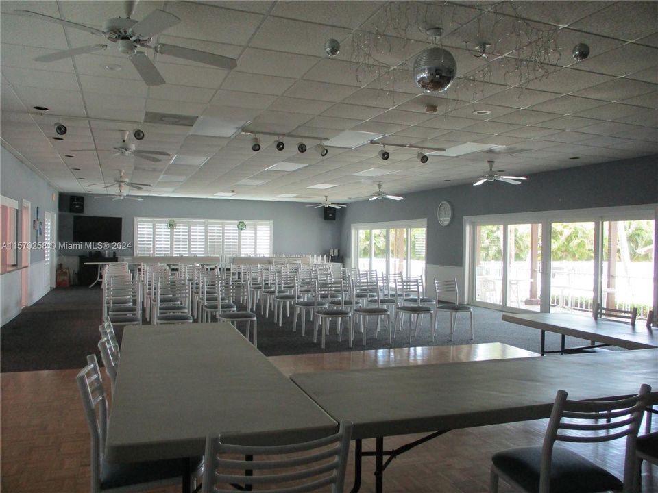 COMMUNITY ROOM WITH SLIDING GLASS FOR MEETING & ENTERTAINMENT