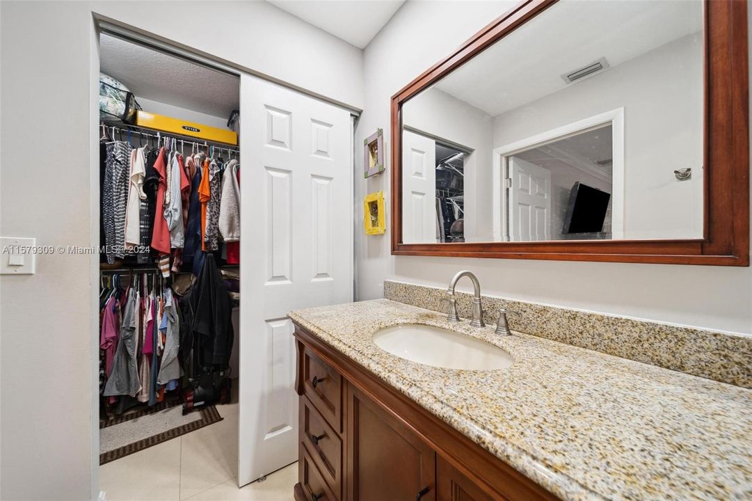 Primary bathroom with new vanity and walk in closet