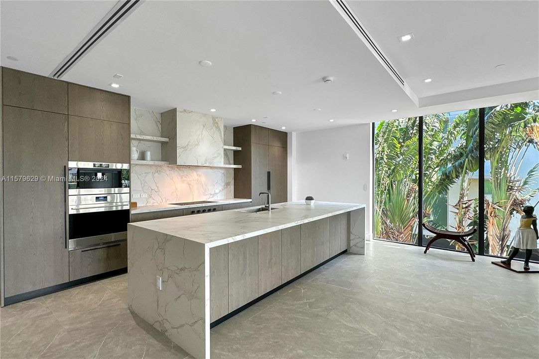 spacious kitchen and living room.