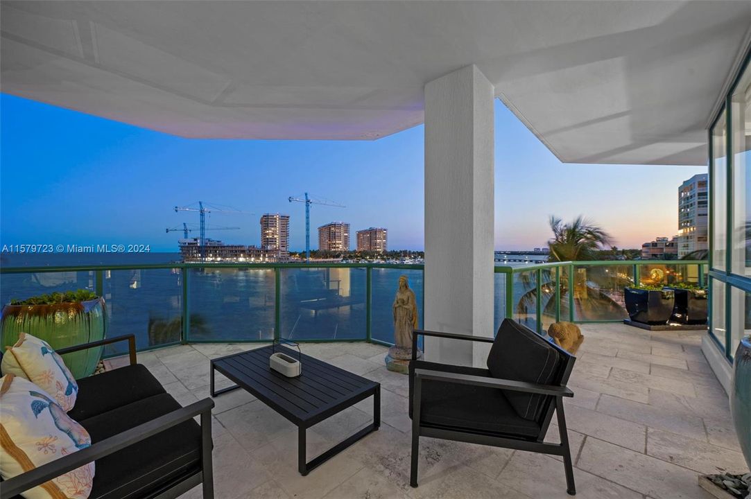 sitting area in wide balcony with bay views