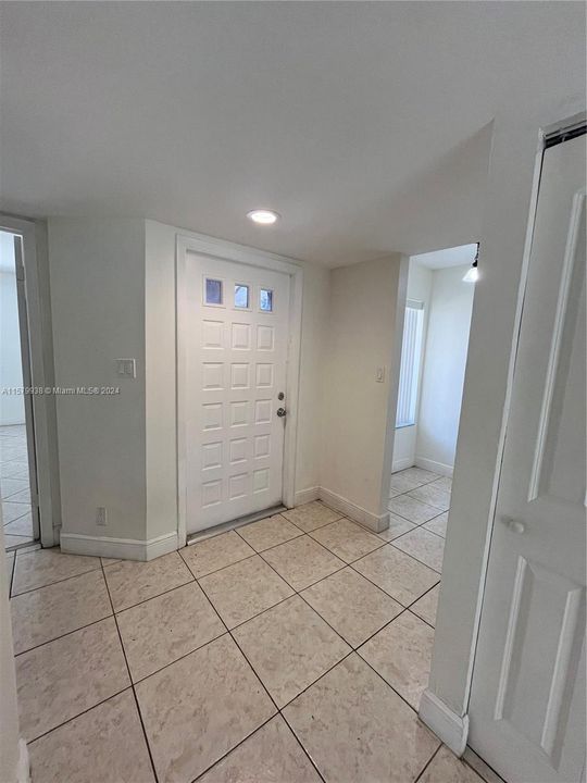 Front Door / Primary bedroom on the left / Breakfast Nook on the right.