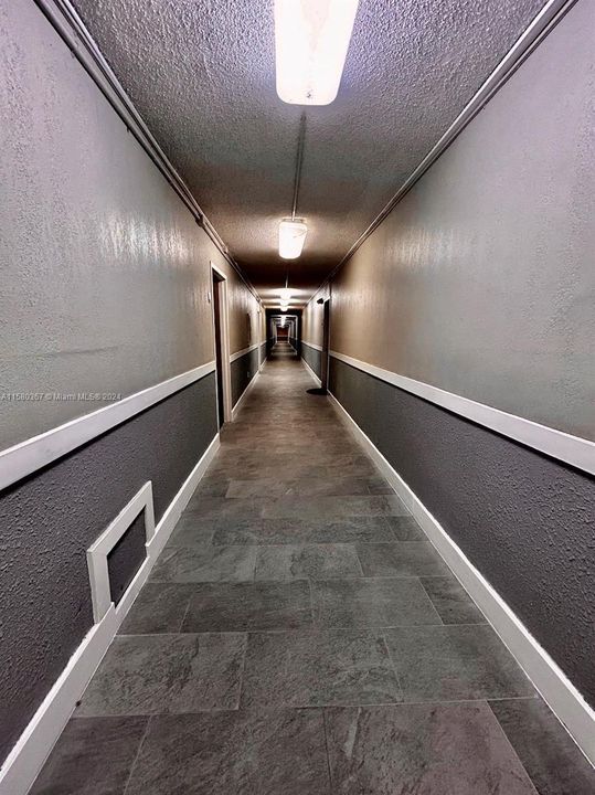 All the hallways will have tile like this one. Currently there is carpet.