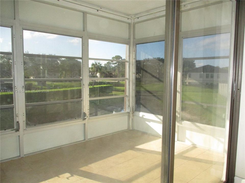 PATIO WITH VIEW OF CLUBHOUSE & WATER