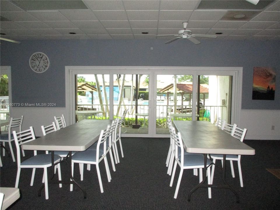 COMMUNITY ROOM WITH SLIDING DOORS TO POOL AREA