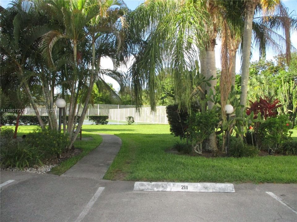 PATHWAY TO TENNIS/PICKLE BALL COURTSAT REAR OF BLDG.