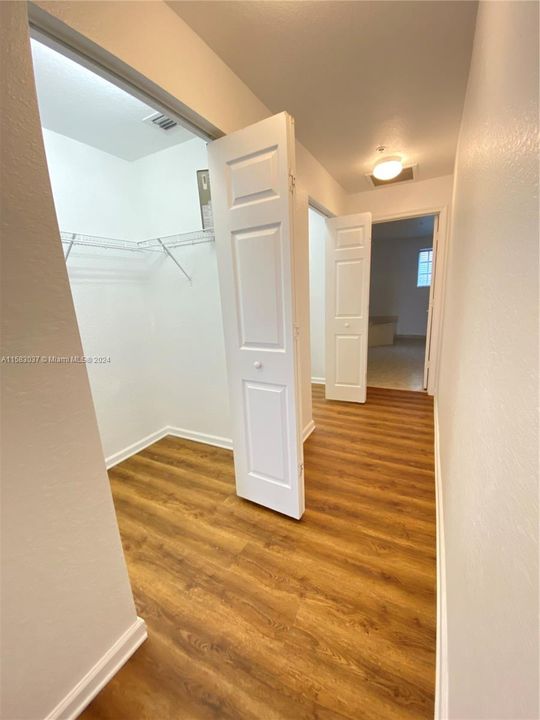 Two walk-in closets in Primary bedroom