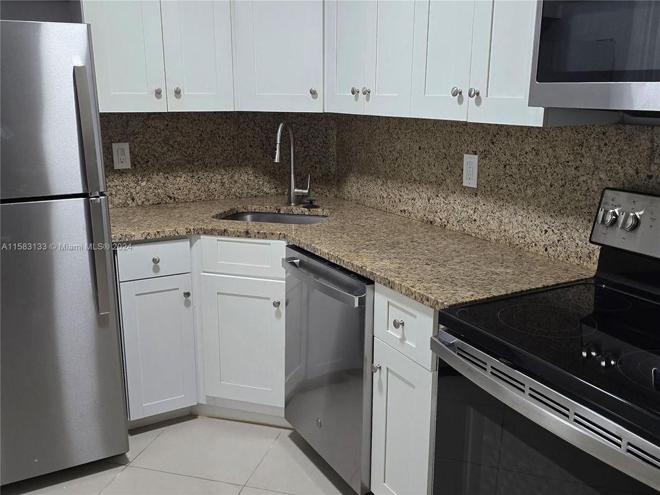 All new Stainless Steel Appliances, custom white cabinetry and granite counter