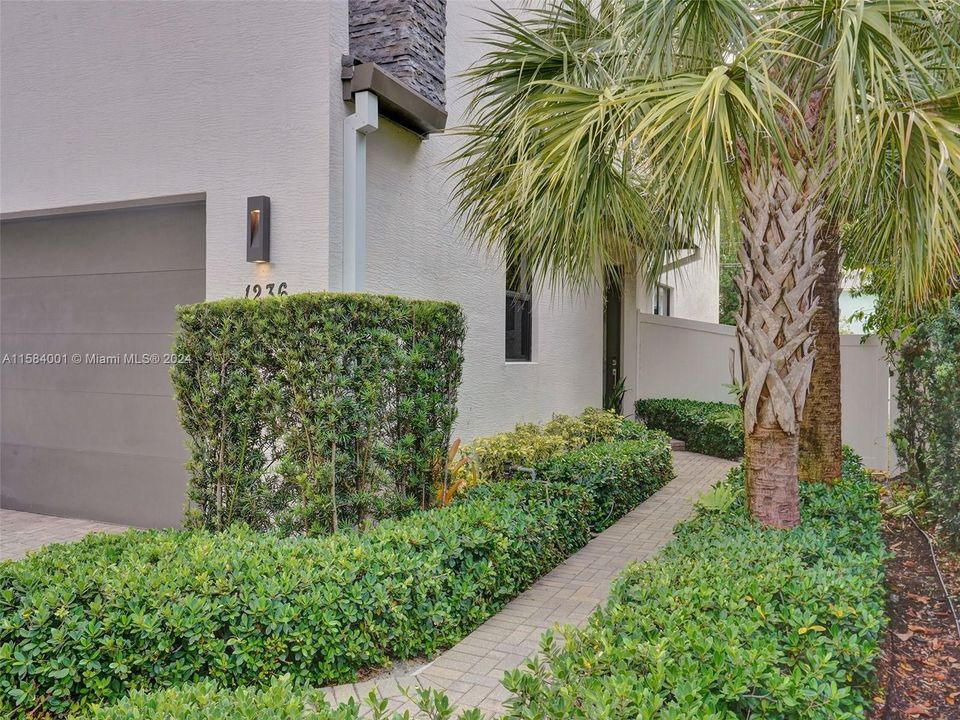 Beautifully landscaped entrance into your new home!