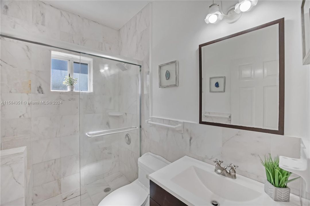 Guest bathroom with Marble wall and floor