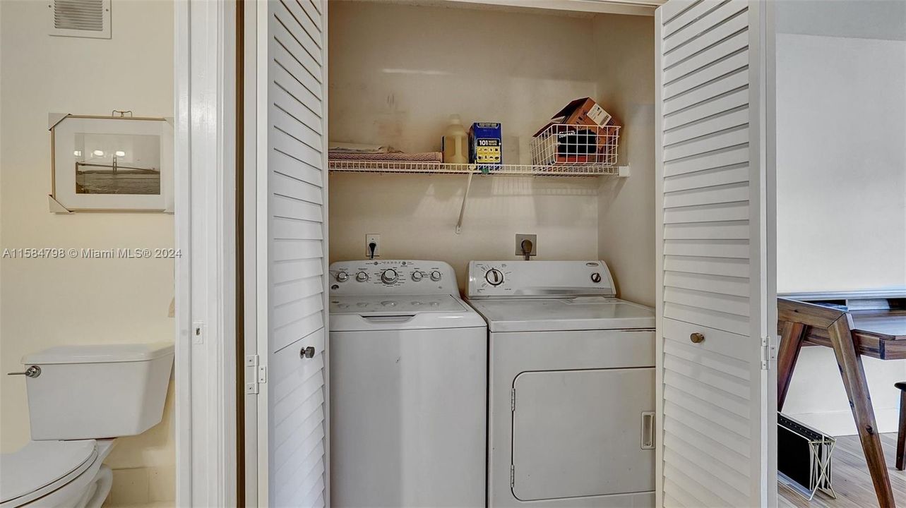 Laundry contains full-sized washer and dryer for full convenience.
