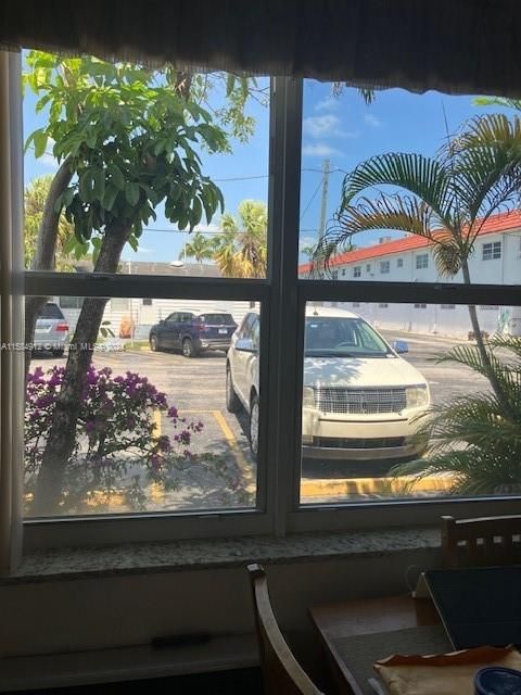 Assigned parking just outside your door. Tropical view!
